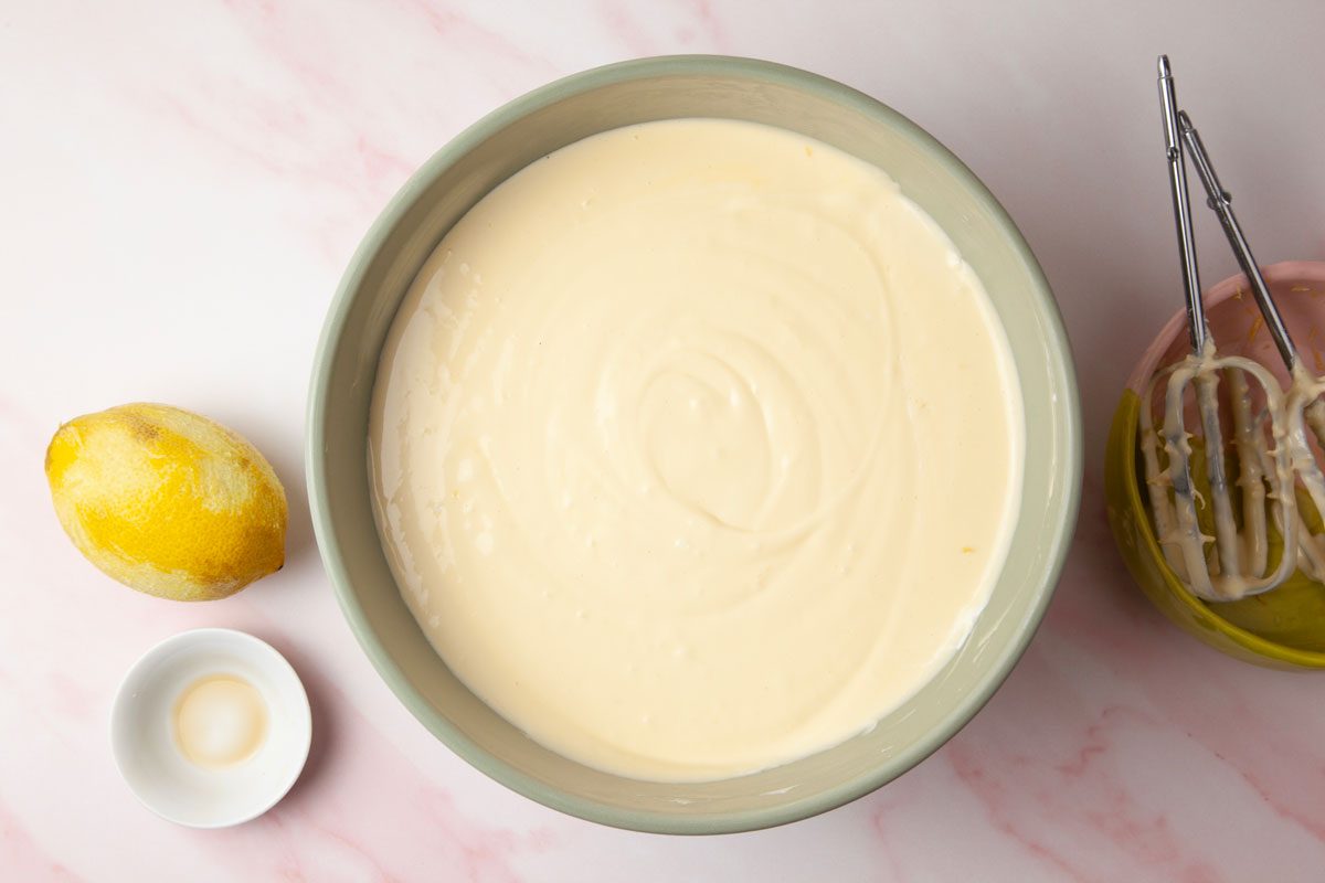 Step 2 of Taste of Home Raspberry Cheesecake is to beat cream cheese on medium speed until smooth, four to five minutes. Add the sugar and beat until fluffy.