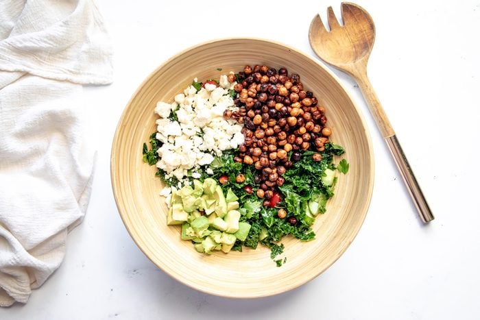 Overhead shot for Taste of Home Roasted Chickpea Salad with all ingredients in a large salad bowl.