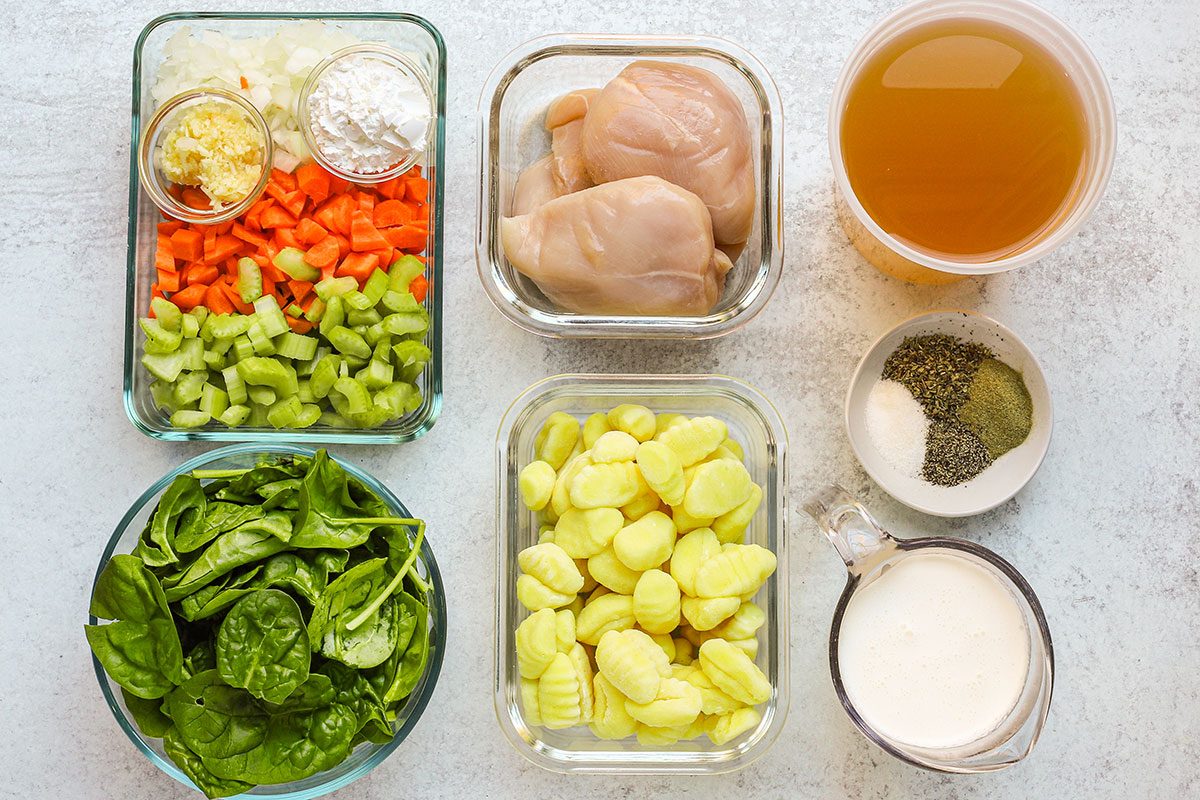 The ingredients for slow cooker chicken gnocchi soup, an easy everyday recipe.