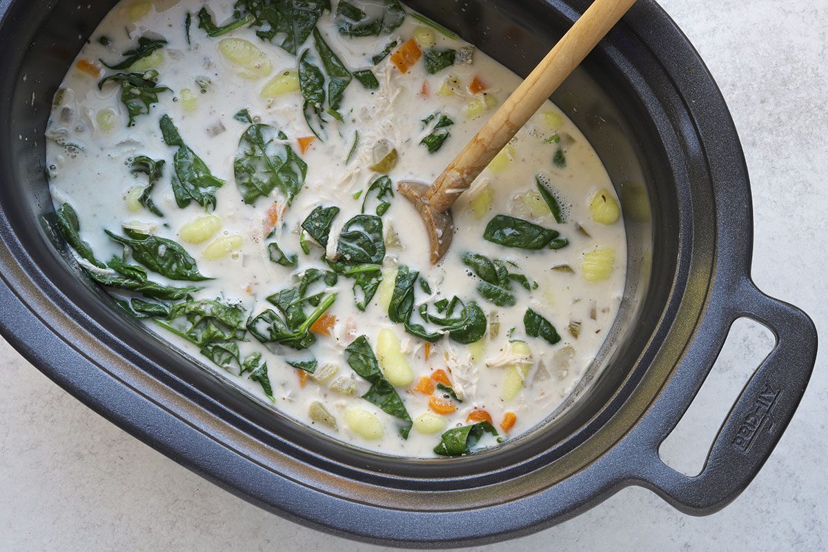 Slow cooker chicken gnocchi preparation, ready to serve.
