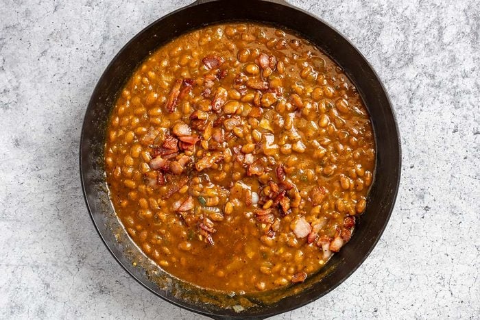 Taste of Home Smoked Baked Beans photo of all the ingredients simmered in the cast iron skillet.