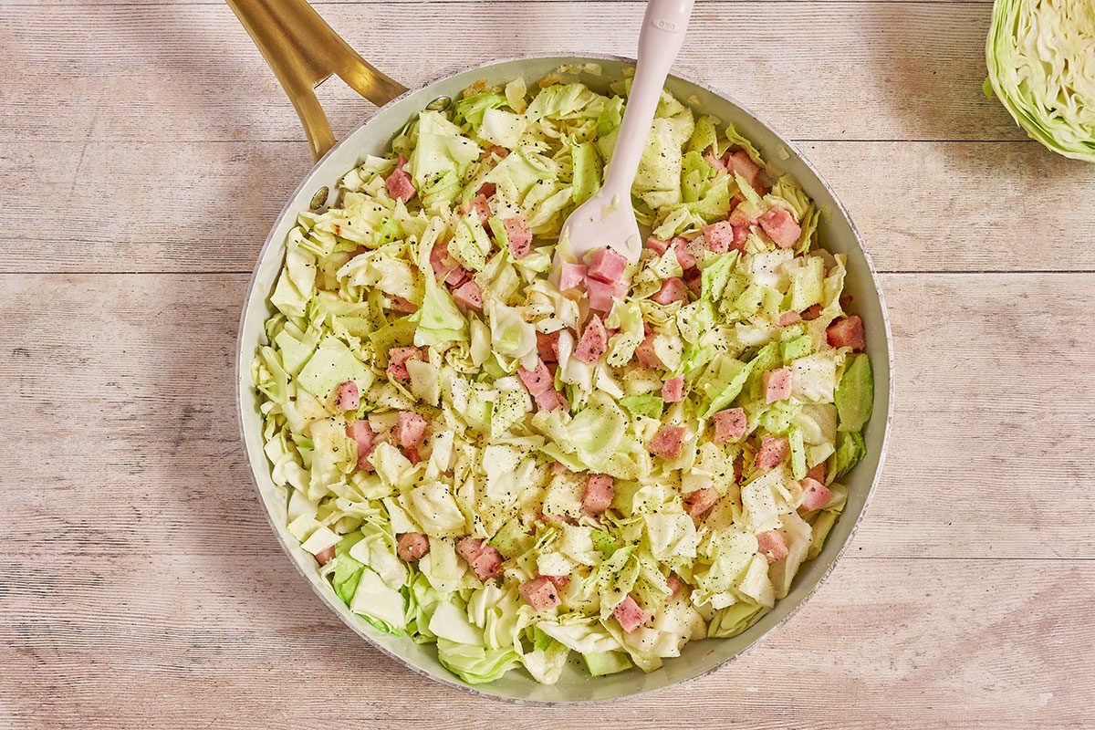 making Smothered Cabbage in a skillet