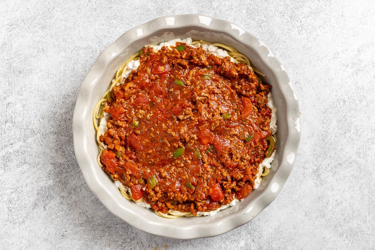 Taste of Home Spaghetti Pie photo of assembling the spaghetti pie.