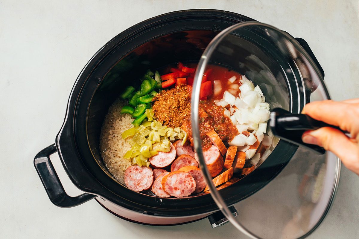Ingredients for the Spanish rice with Sausage recipe by Taste of Home combined in the slow cooker before cooking