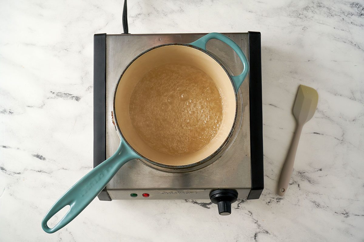 In a medium saucepan, bring sugar and water to a boil, stirring occasionally to dissolve the sugar completely for the Strawberry Syrup recipe, by Taste of Home.