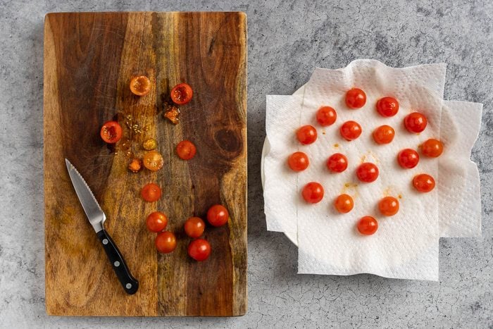 Taste of Home Stuffed Cherry Tomatoes photo of prepping the tomatoes.