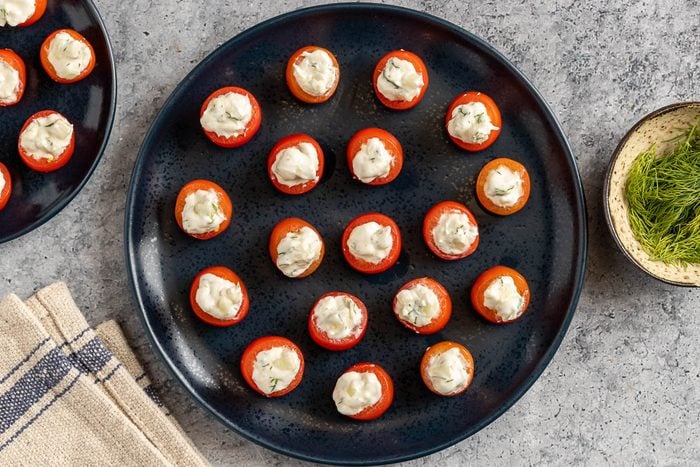 Taste of Home Stuffed Cherry Tomatoes photo of the finished recipe on a serving platter.