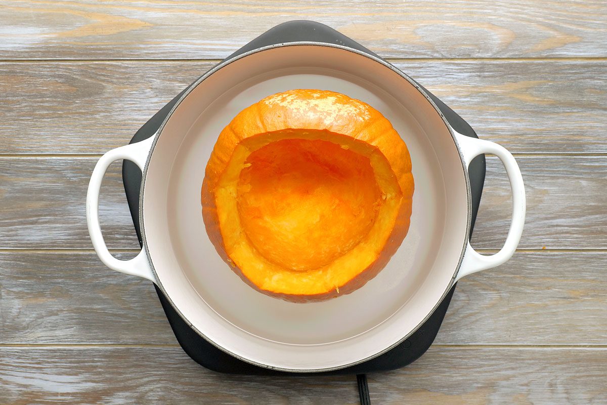 overhead of pumpkin in a dutch oven