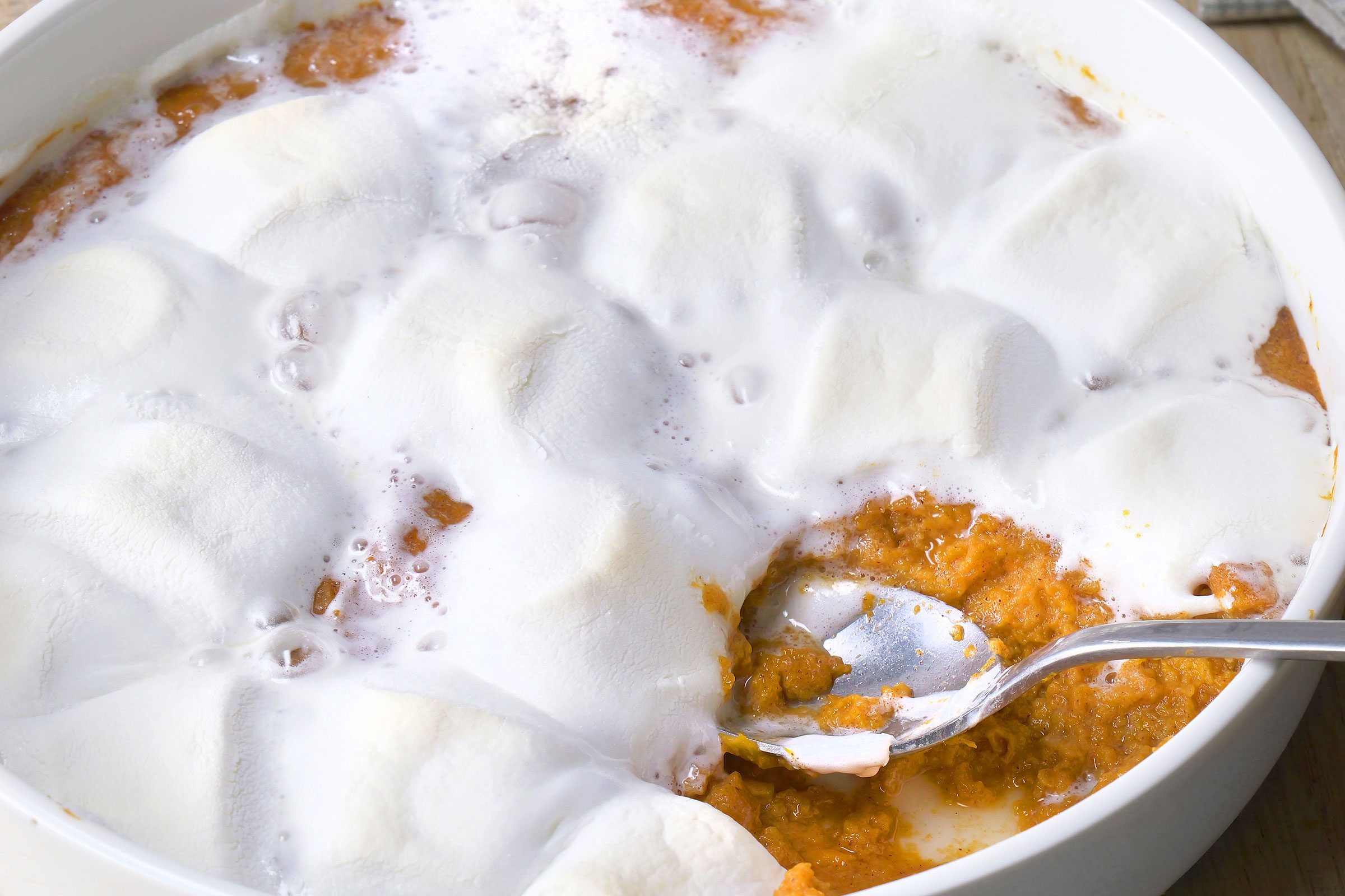 Sweet Potato Casserole with melted marshmallows close up