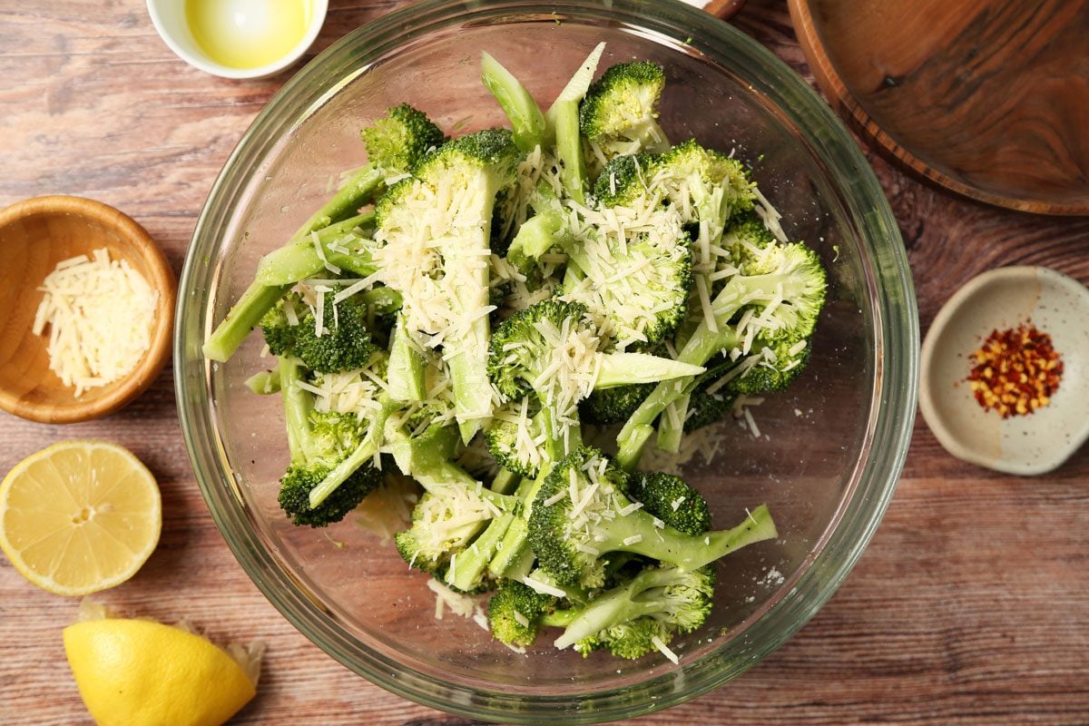 Process of making Taste of Home's Grilled Broccoli grilled and on a plate on a brown wooden surface.