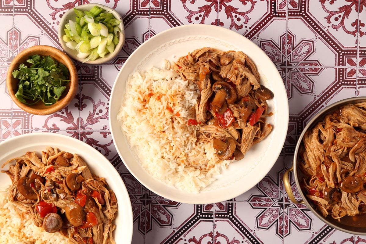 Process of making Taste of Home's Pork Bowl in a pressure cooker on a red and white tiled surface.