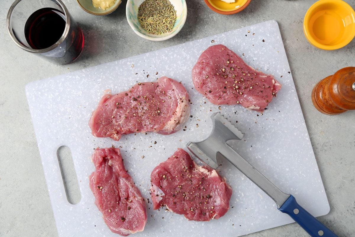 Process of making Taste of Home's Pork and Red Wine Sauce on a grey marble surface.