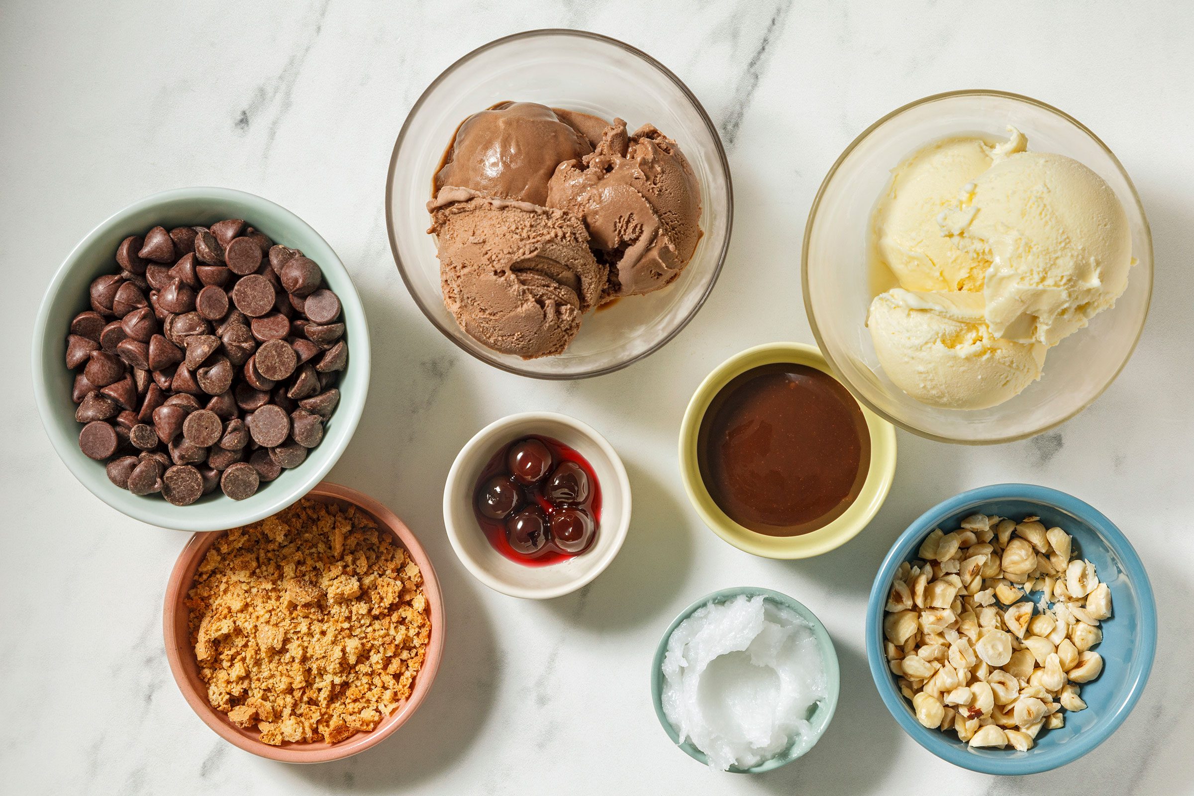 Ice cream, cherries, hot fudge, cookies and toppings to make Tartufo ice cream