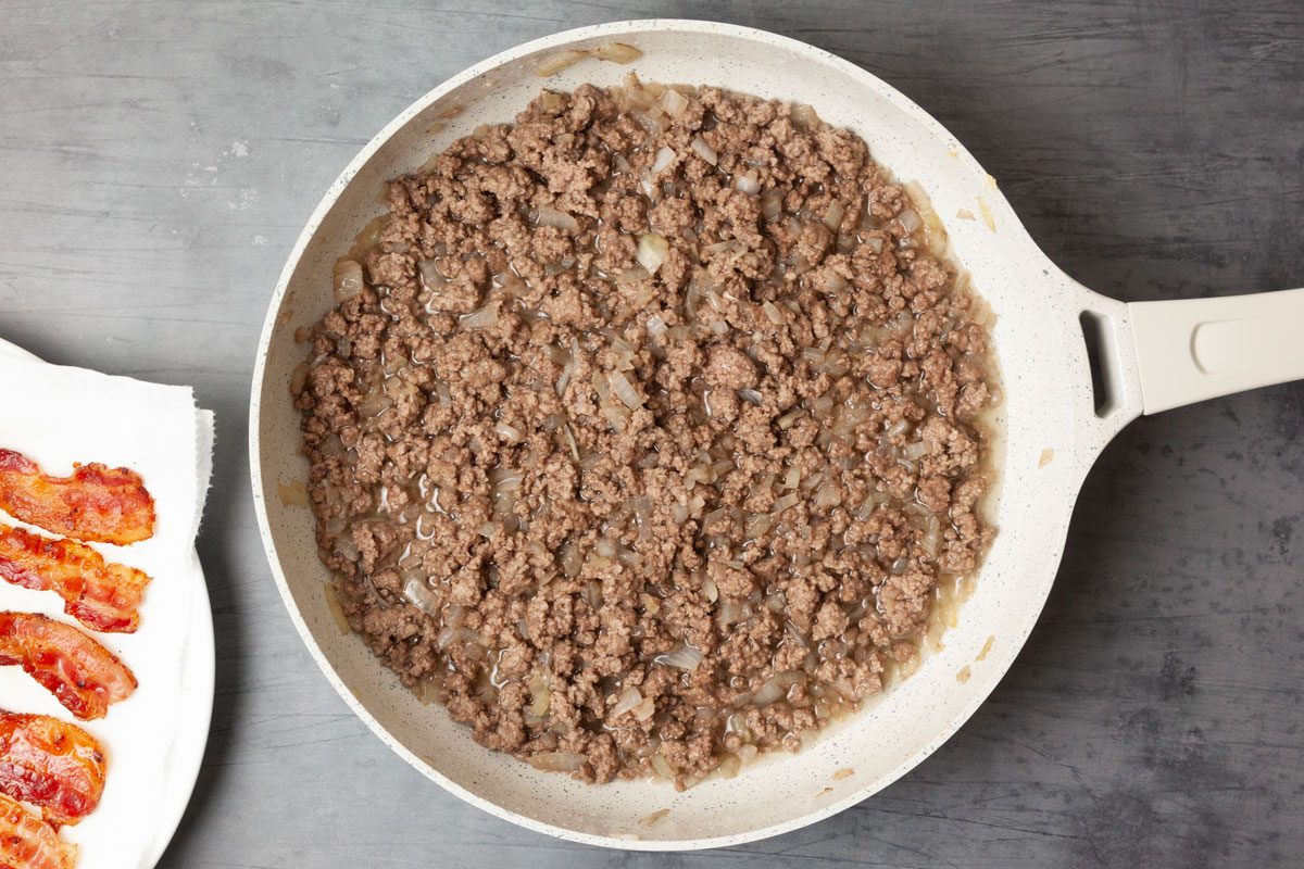 Step 2 of Taste of Home Cowboy Stew is to brown the onion and beef