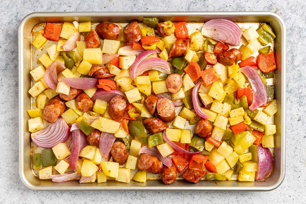 Taste of Home Andouille Sausage and Peppers photo of the roasted ingredients on a sheet pan.