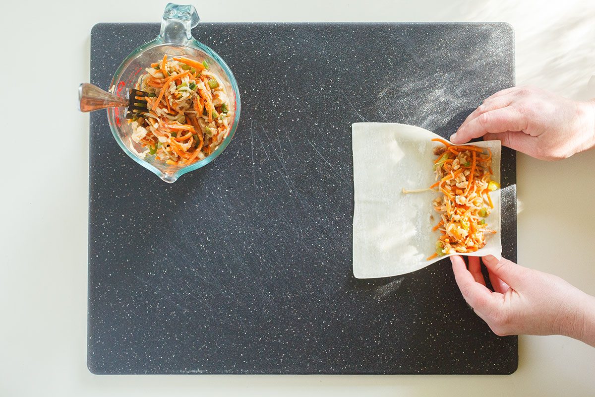 Rolling Egg Roll wrapper in vegetables