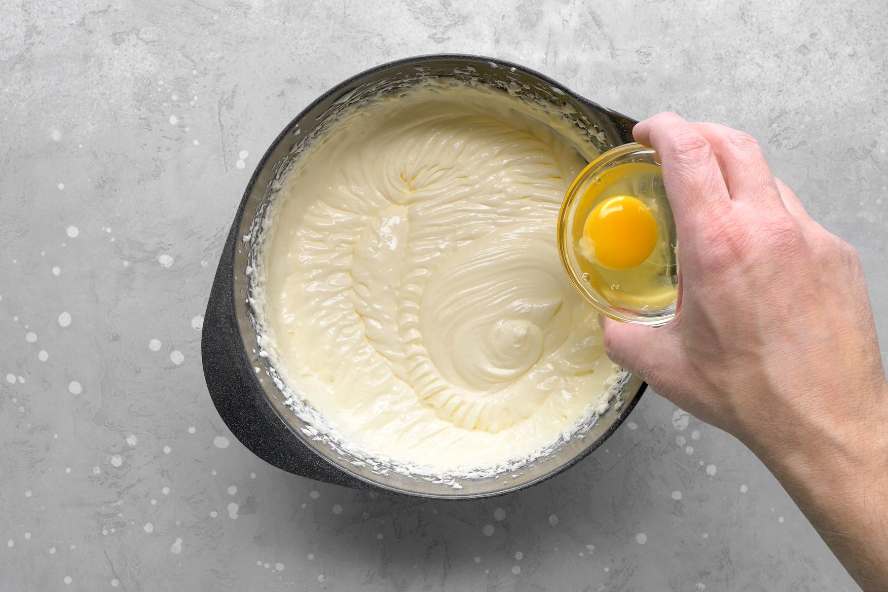 Add the whole eggs and egg yolk, one at a time, beating well after each addition until fully incorporated.