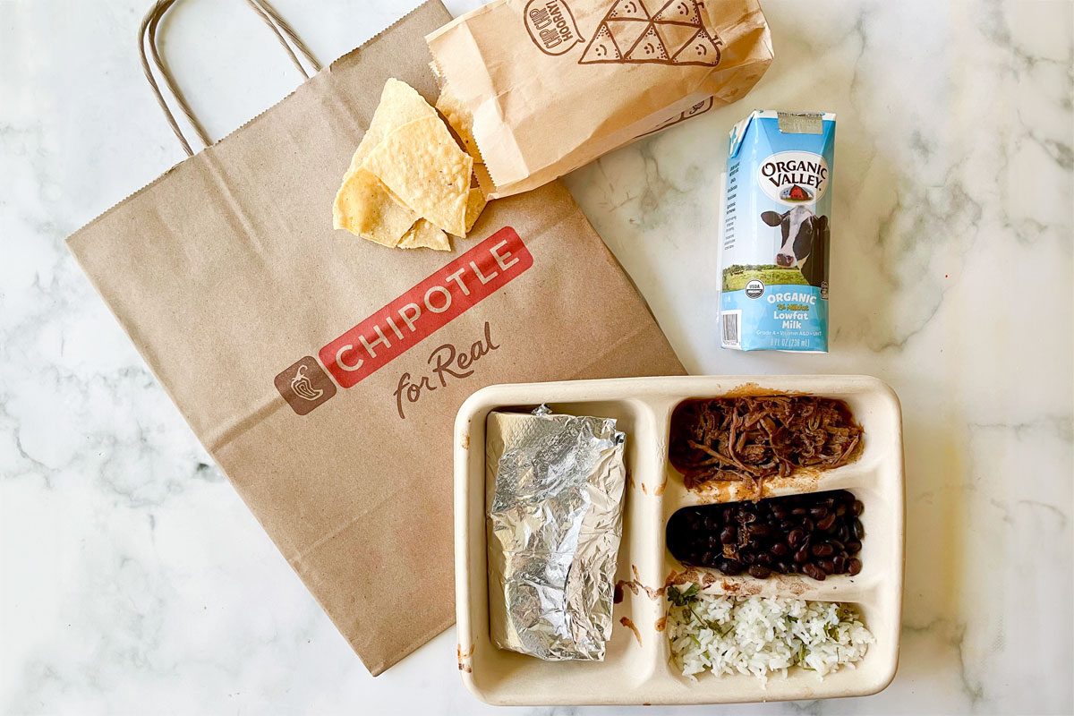 Chipotle Fast Food Kids Meal items arranged on marble kitchen counter