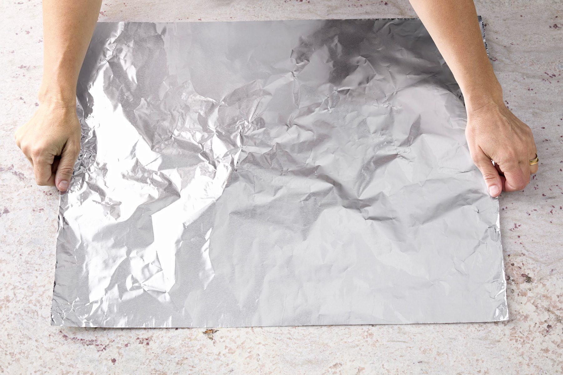 To make a form, roll a 24-inch sheet of foil.