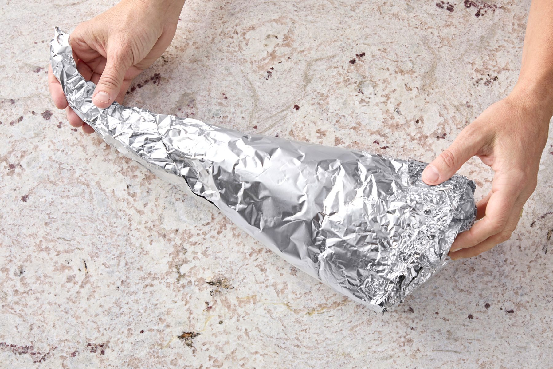 Curve pointed end to one side to create cornucopia shape.