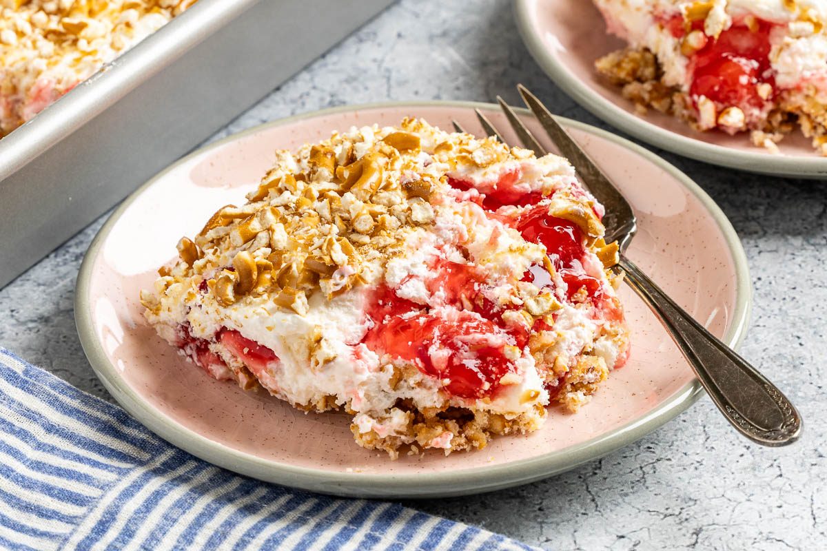 Taste of Home Cherry Pretzel Dessert photo of the finished recipe served on plates.