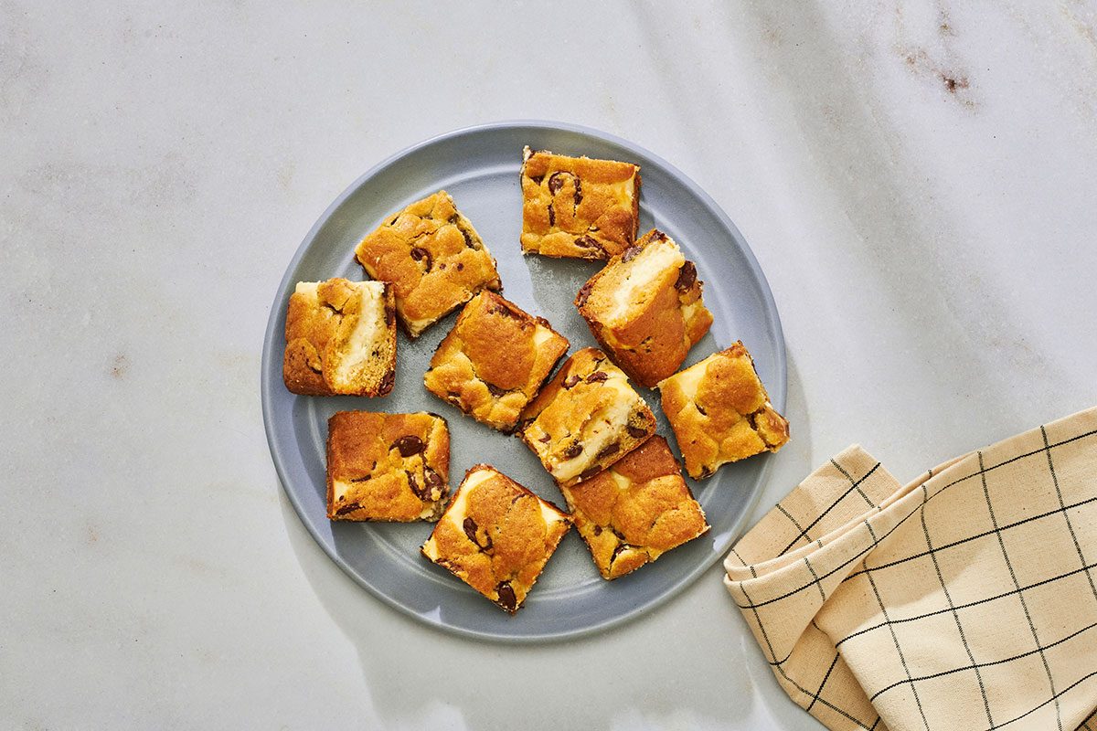 Chocolate chip chees bars served on a serving plate