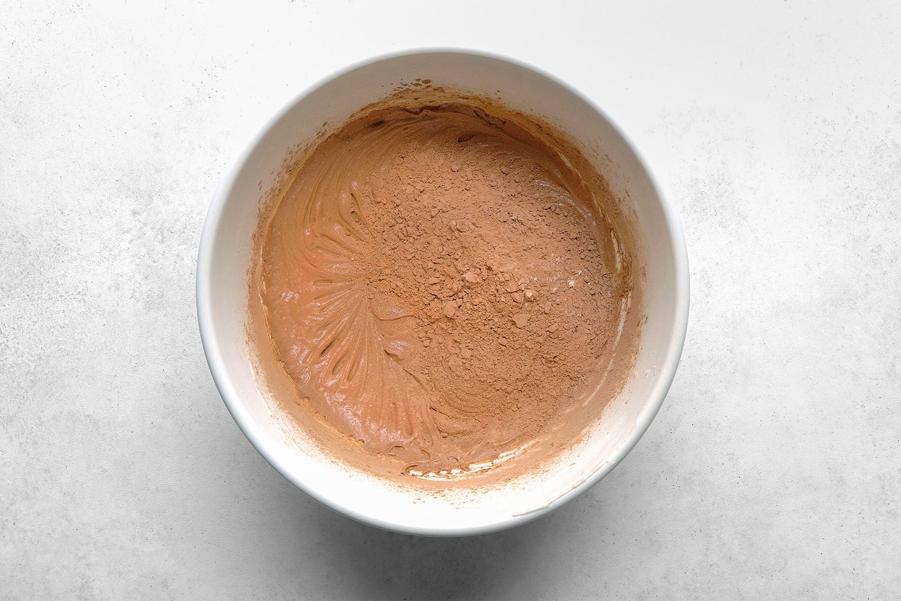 In another large bowl, whisk together flour, cocoa, baking powder and salt.