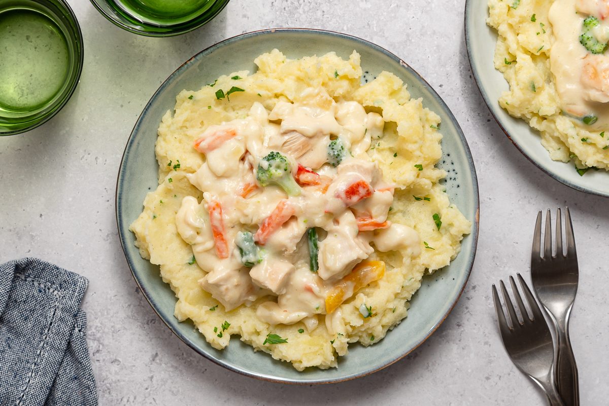 Creamed Turkey Over Mashed Potatoes Inside Plates