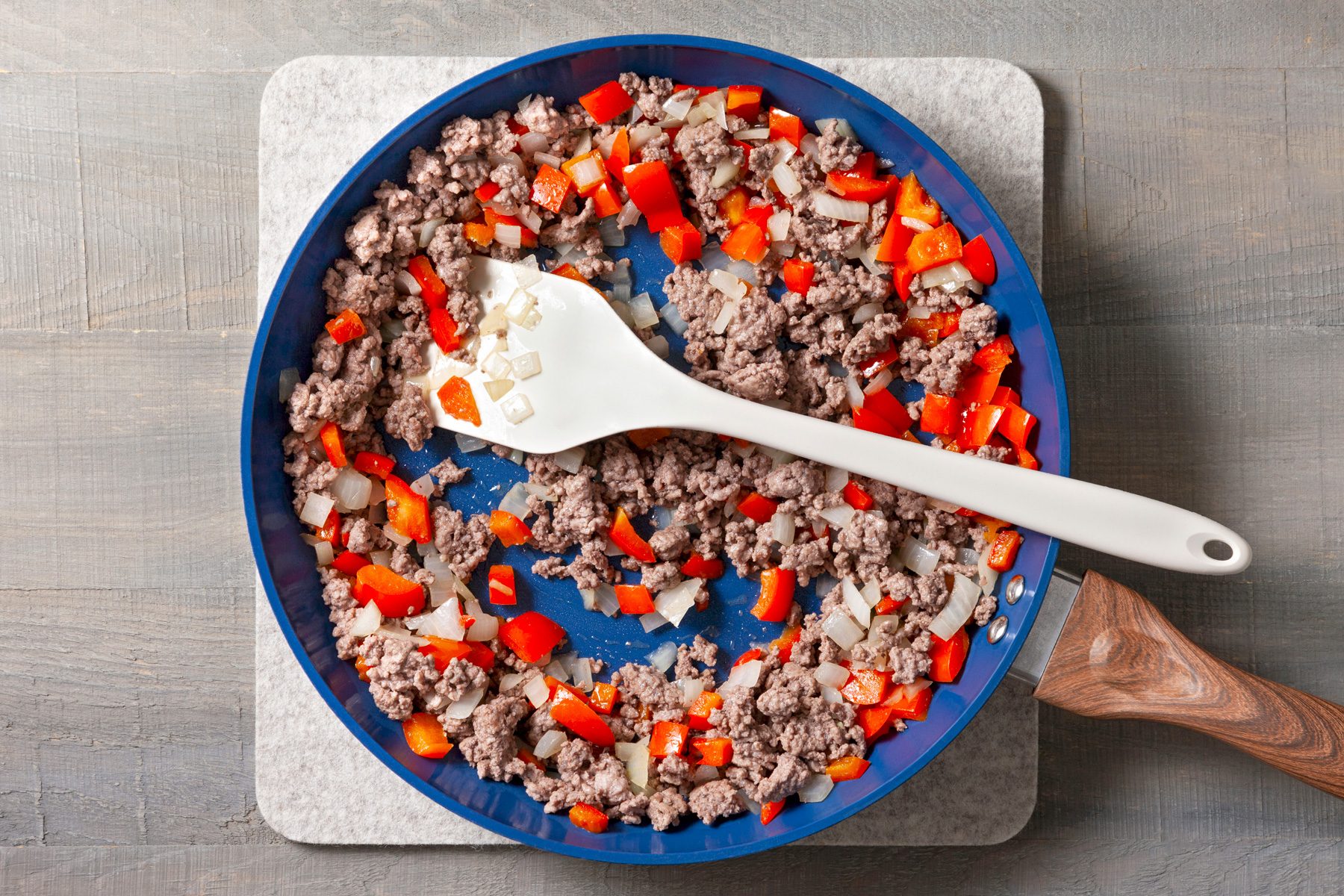 In a large skillet, cook ground beef, red pepper, and onion over medium heat until the beef is browned.
