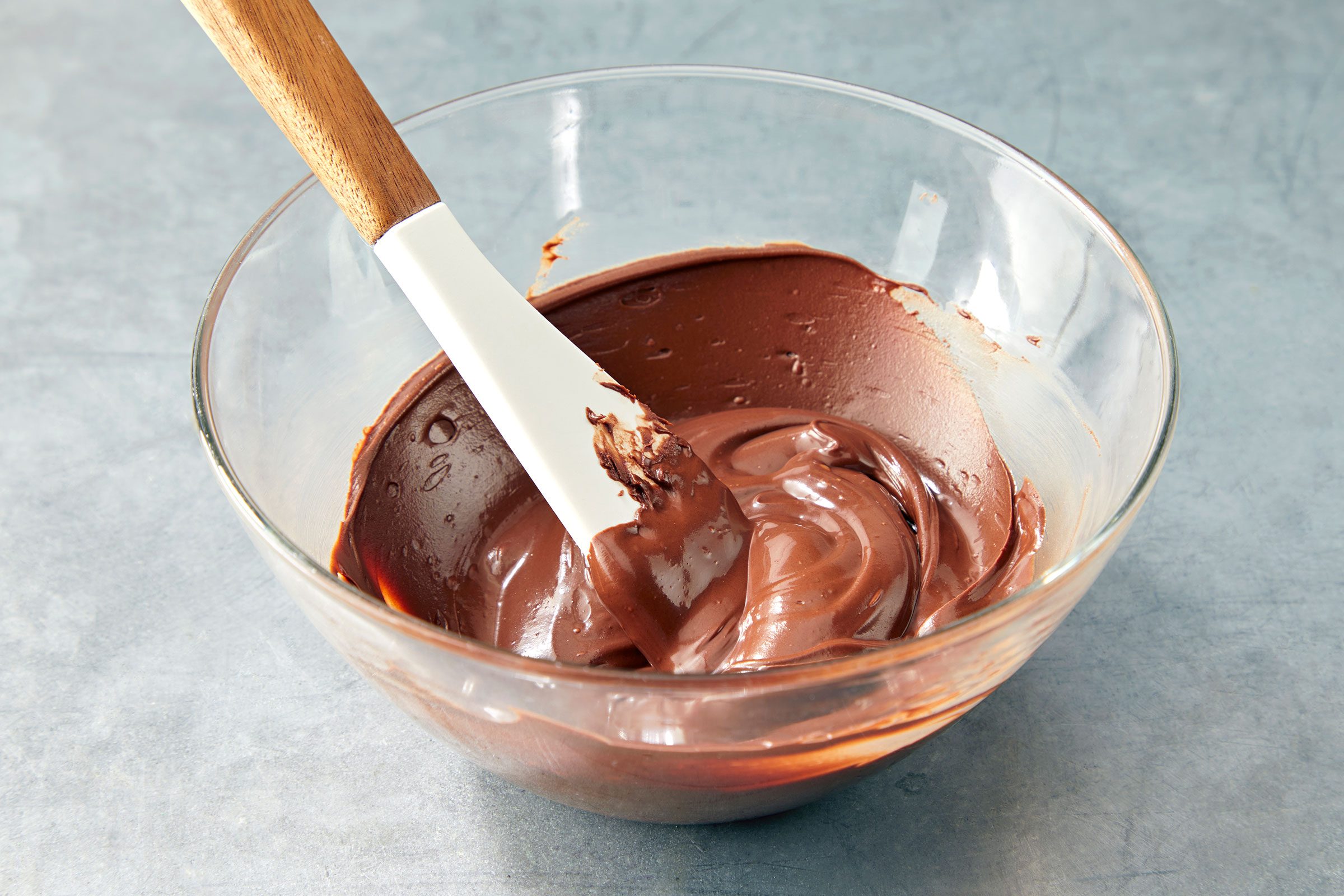 Melted chocolate in a glass bowl