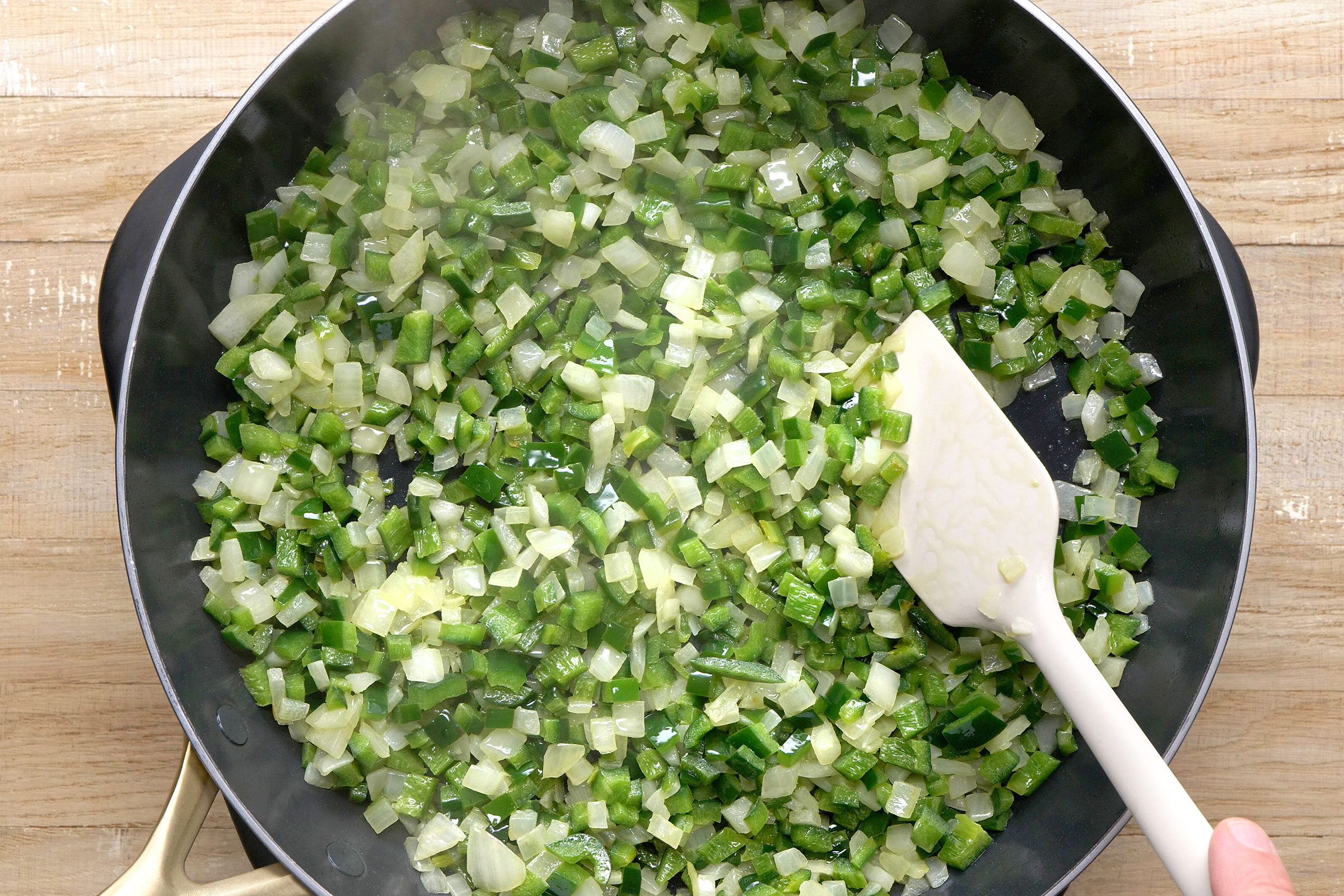 Sautéing vegetables in butter in a skillet 