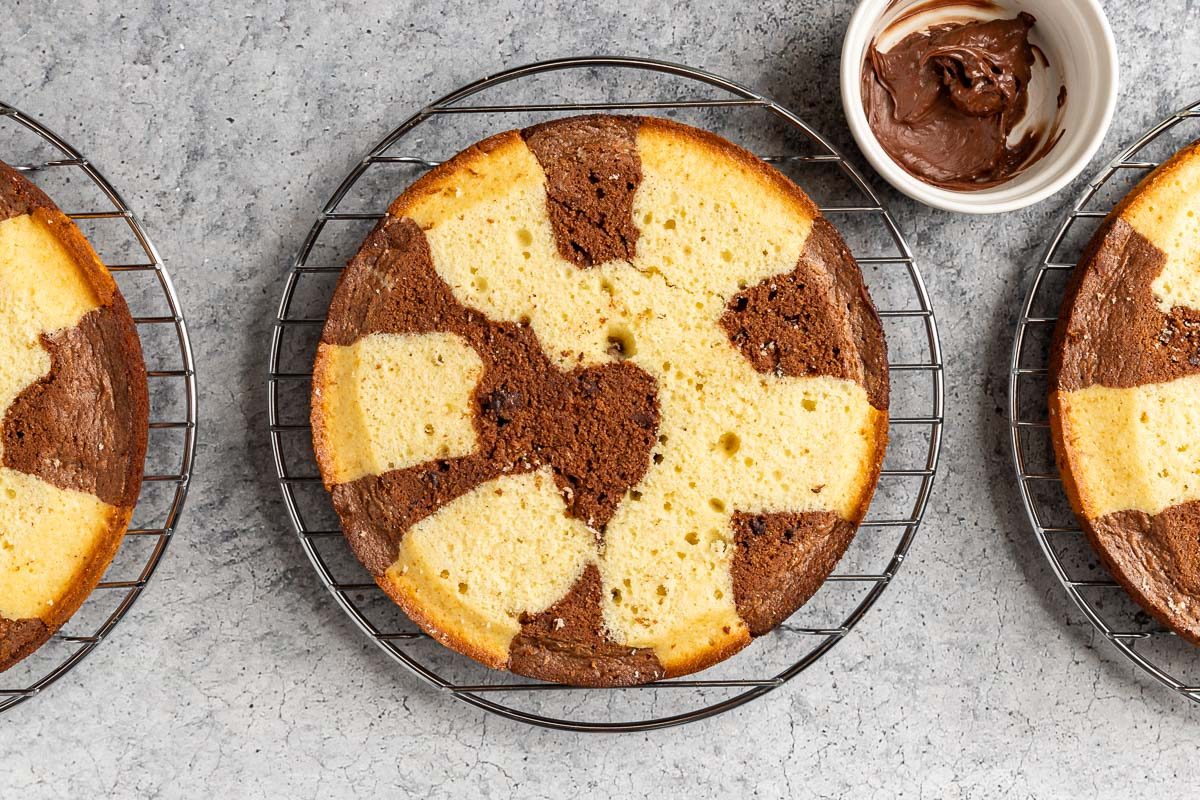 Taste of Home Marble Cake photo of evening out the cake tops and melting the chocolate chips.
