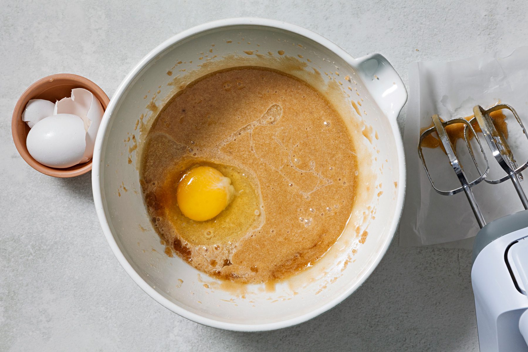 Beat in eggs, one at a time, until fluffy.