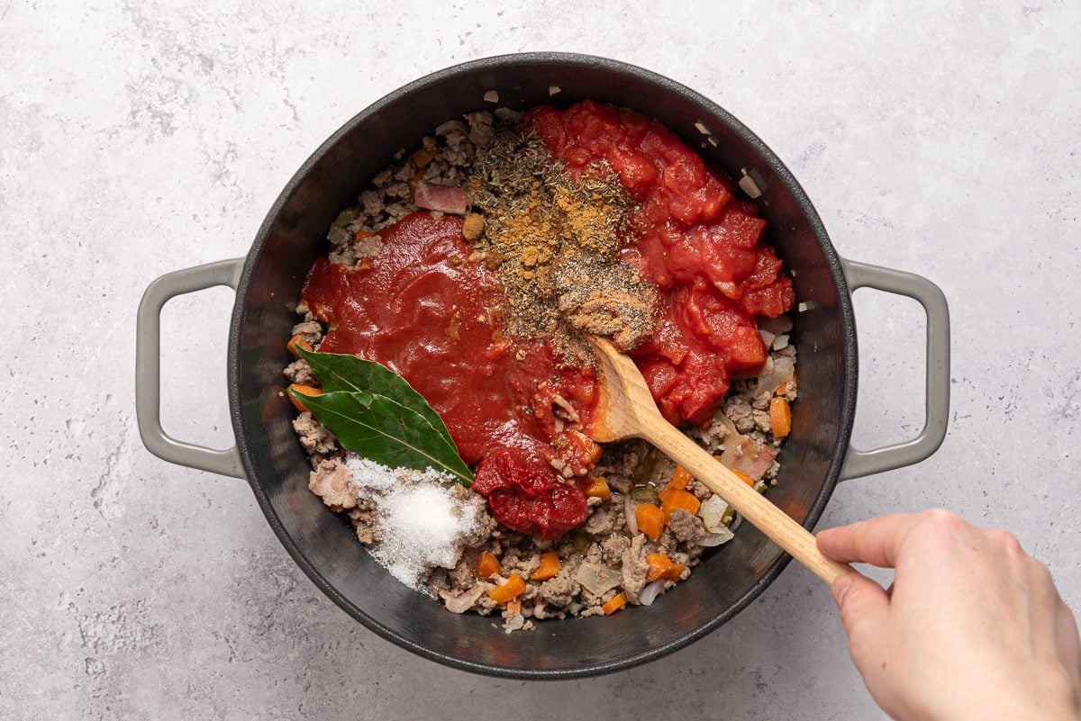 Tomato Sauce, Spices And Bay Leaves Added To Ragu Meat