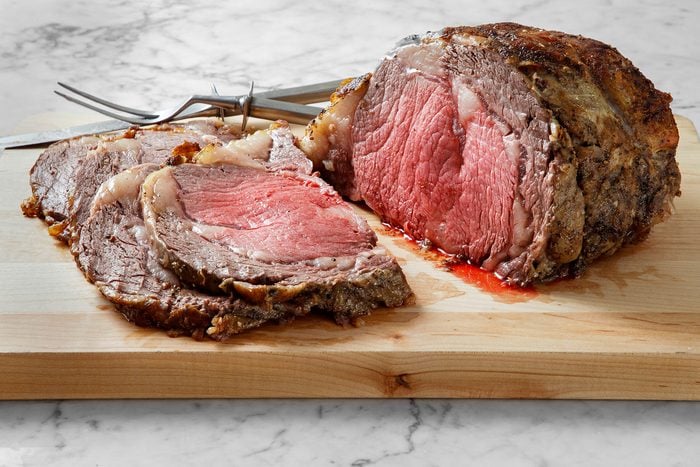 Salt encrusted prime rib carved into slices.