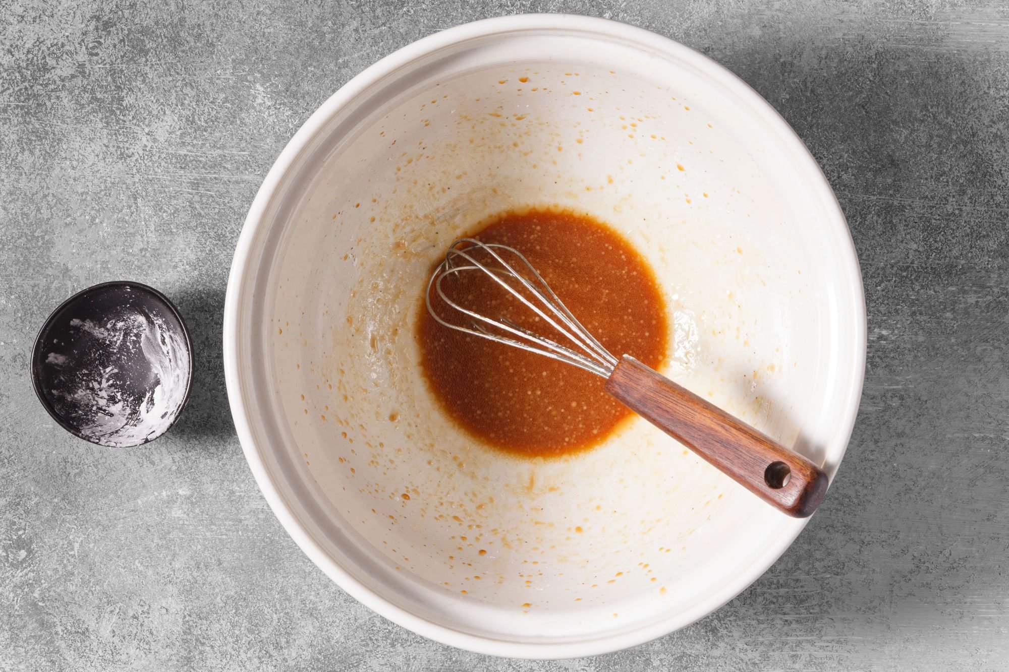 In a large bowl, whisk soy sauce, vineger, sesame oil, mirin if desired, pepper and salt.