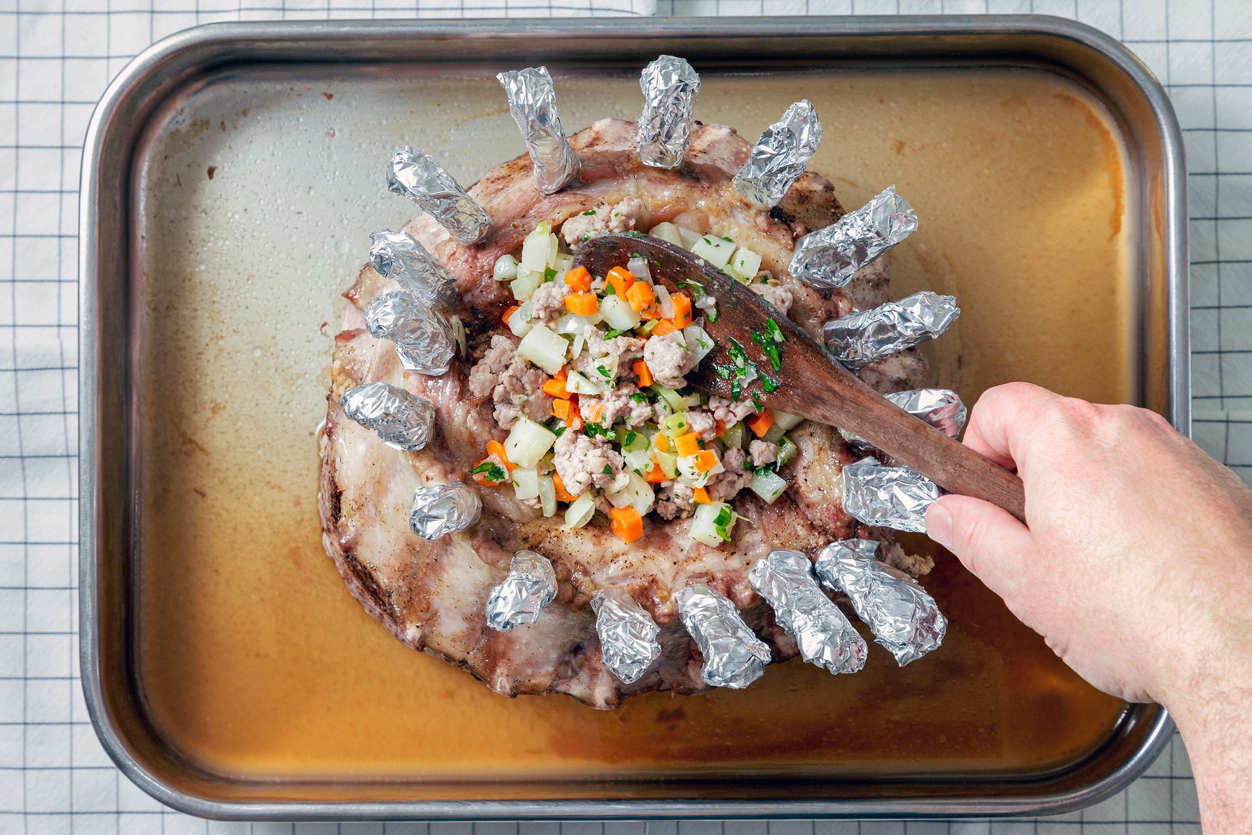 Overhead shot of carefully spoon into center or roast; place any remaining stuffing in a greased baking dish; cover; bake.