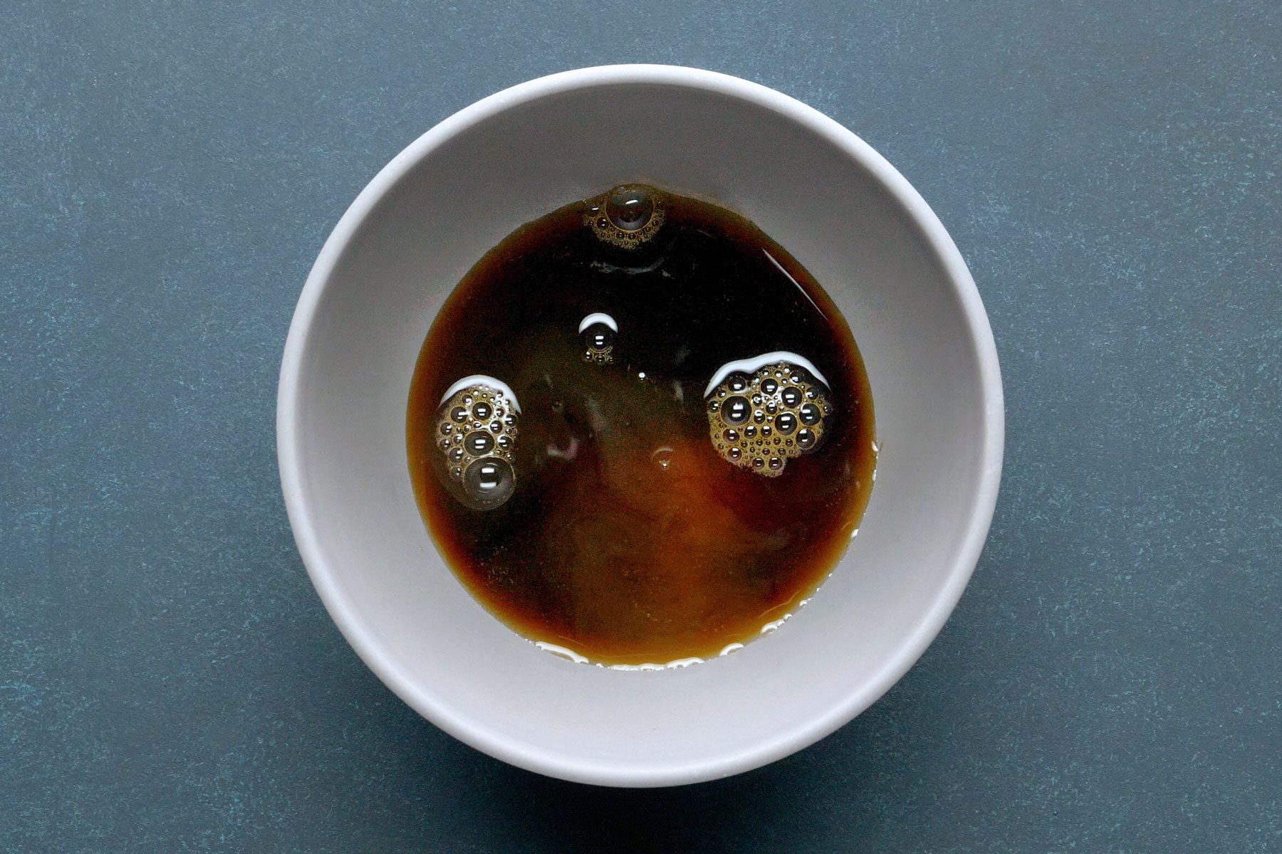 brown sugar, soy sauce, vinegar and lime juice mixed together in a bowl.