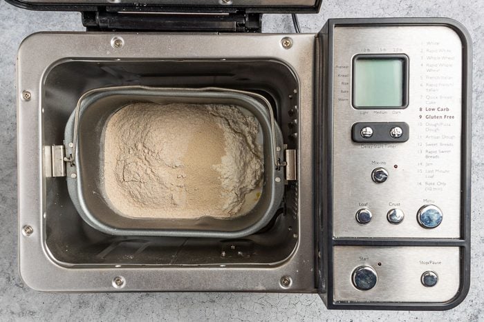 Taste of Home Whole Wheat Bread Machine recipe photo of placing all the ingredients in the bread machine.