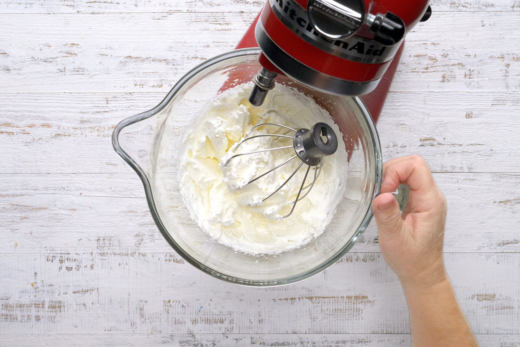 Beating cream in a large bowl until soft peaks form.