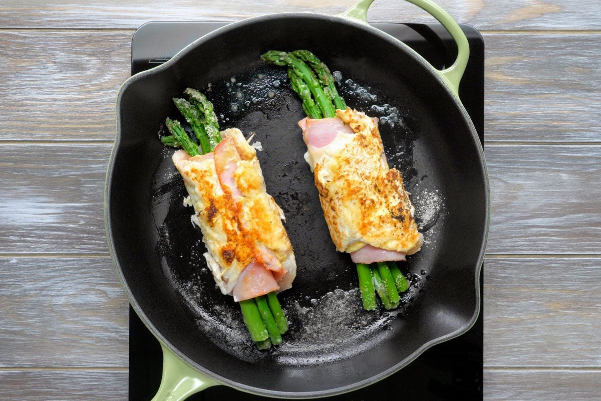 In a large skillet, brown chicken on all sides in butter and oil.