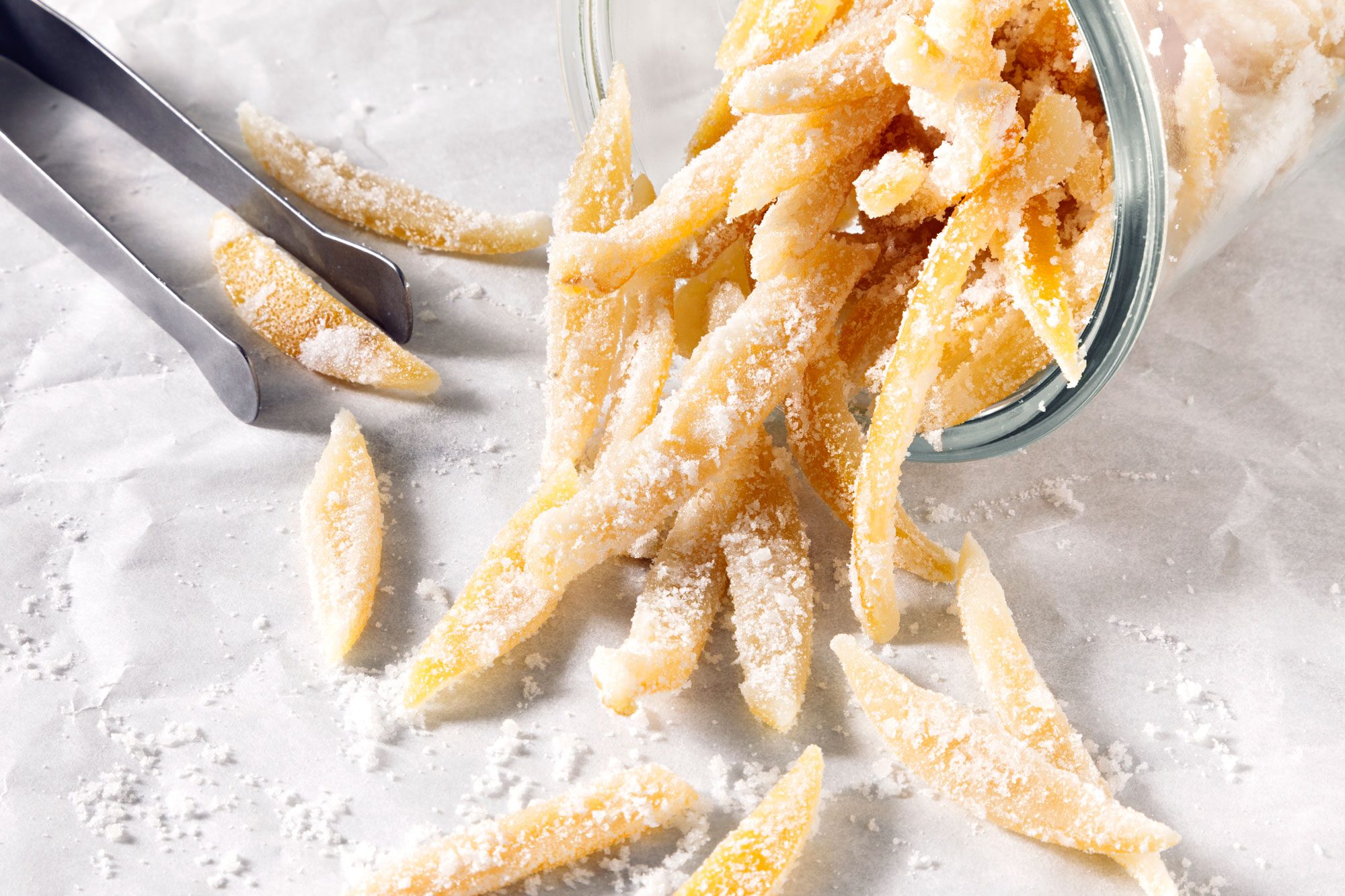 Candied Lemon Peel on white paper surface