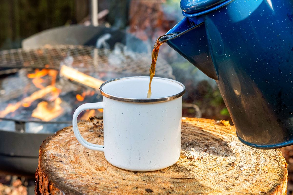 Cowboy coffee made outdoors over wood fire