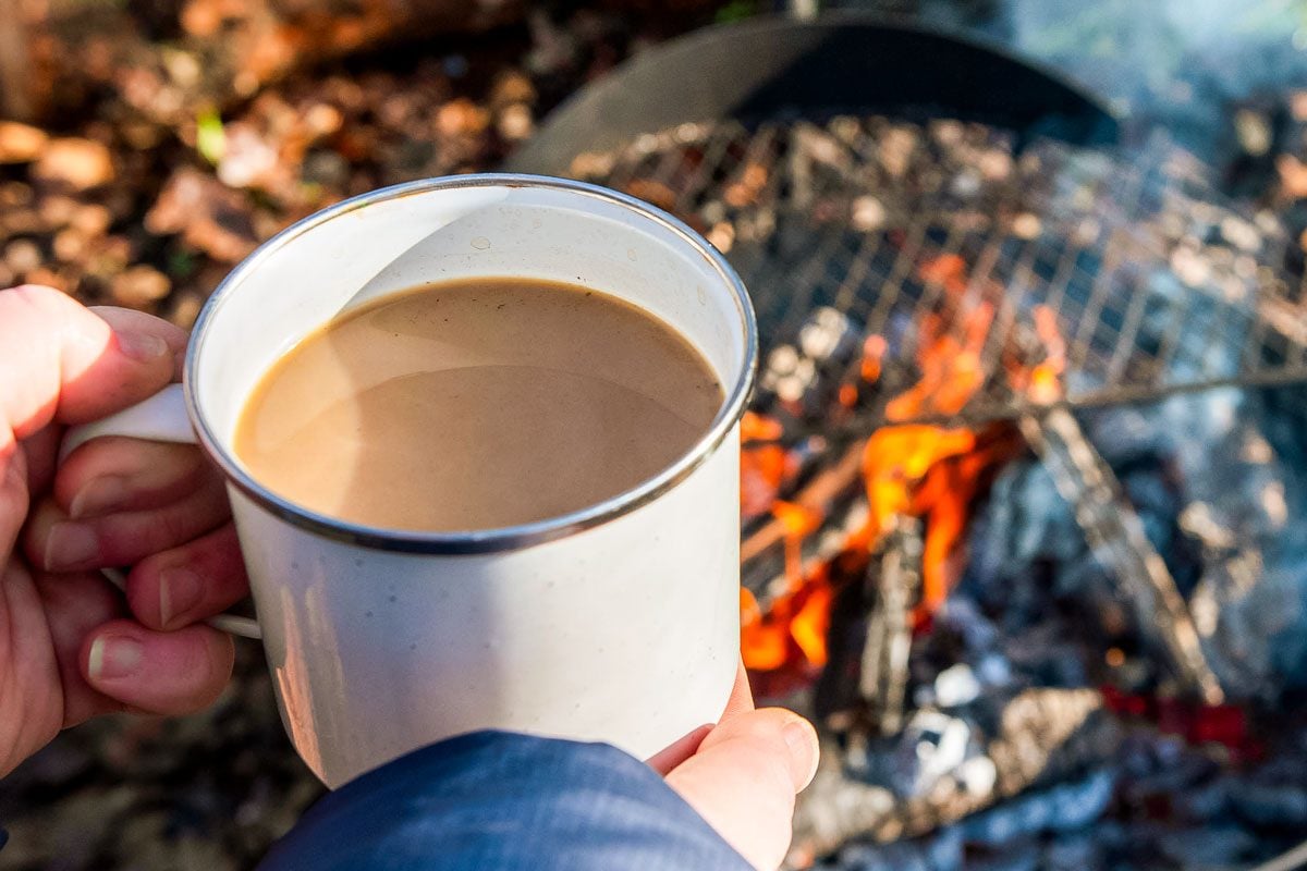 Cowboy coffee made outdoors over wood fire