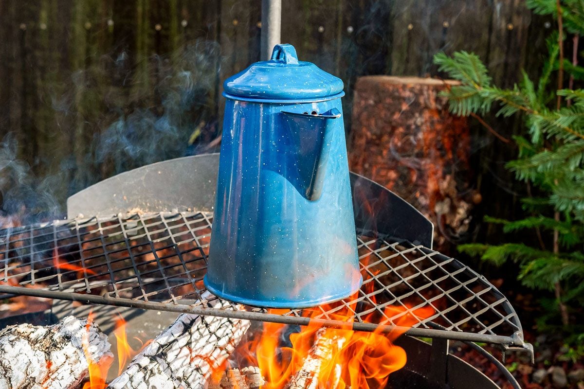 Cowboy coffee made outdoors over wood fire