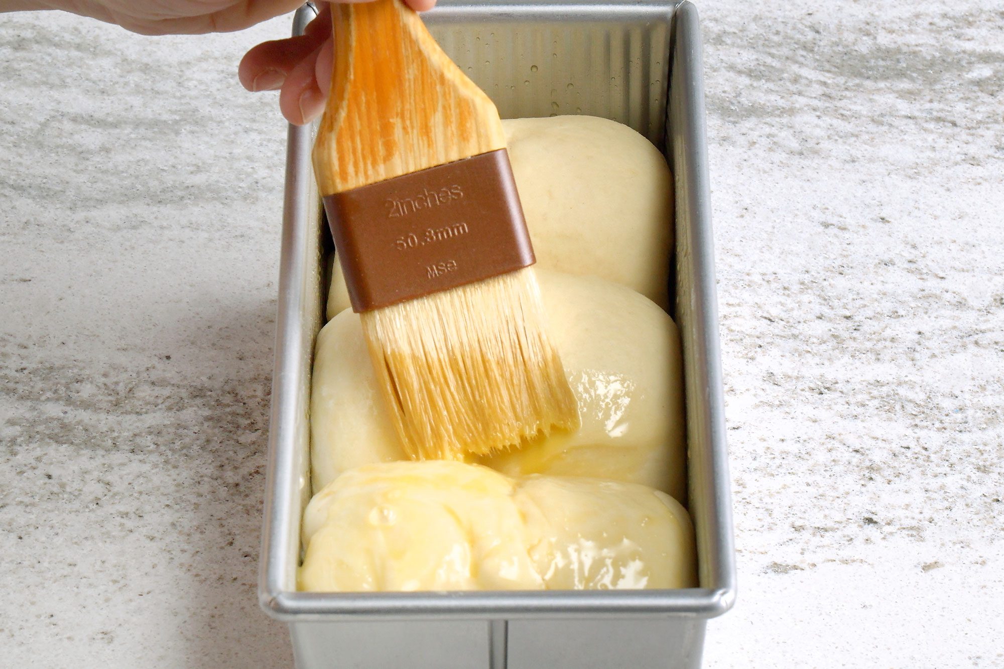 Brush the top of each loaf with the egg wash