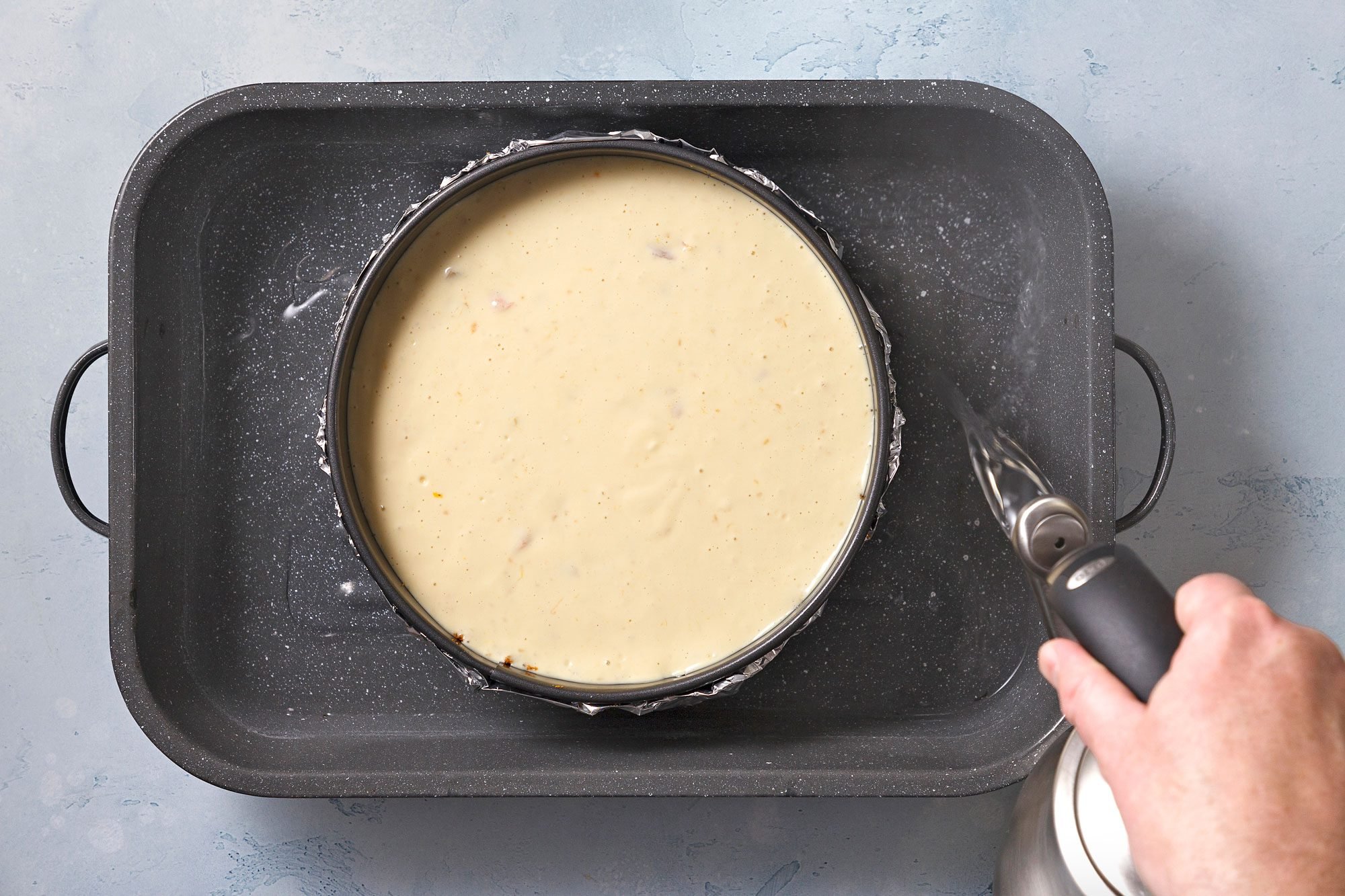 Place springform pan in a larger baking pan; add 1 in. of hot water to larger pan. Bake
