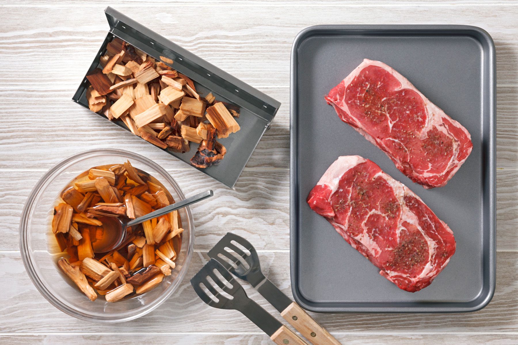 wood chips next to seasoned steak