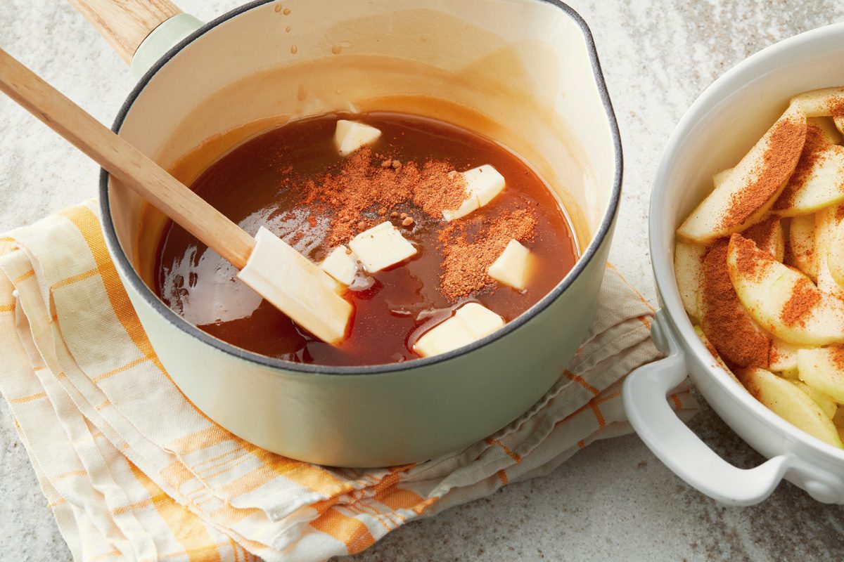 Add nutmeg; vanilla and remaining butter to sauce; pour over apples