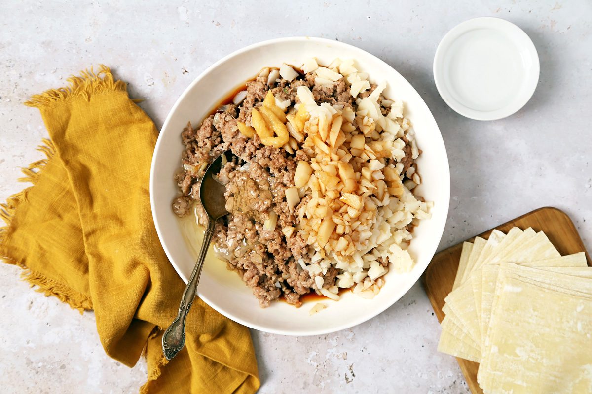 cooked pork, turkey and onion in a large bowl